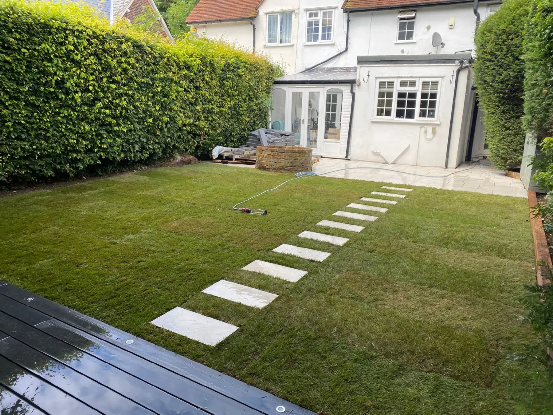 A fresh lawn with stepping stones up to the house