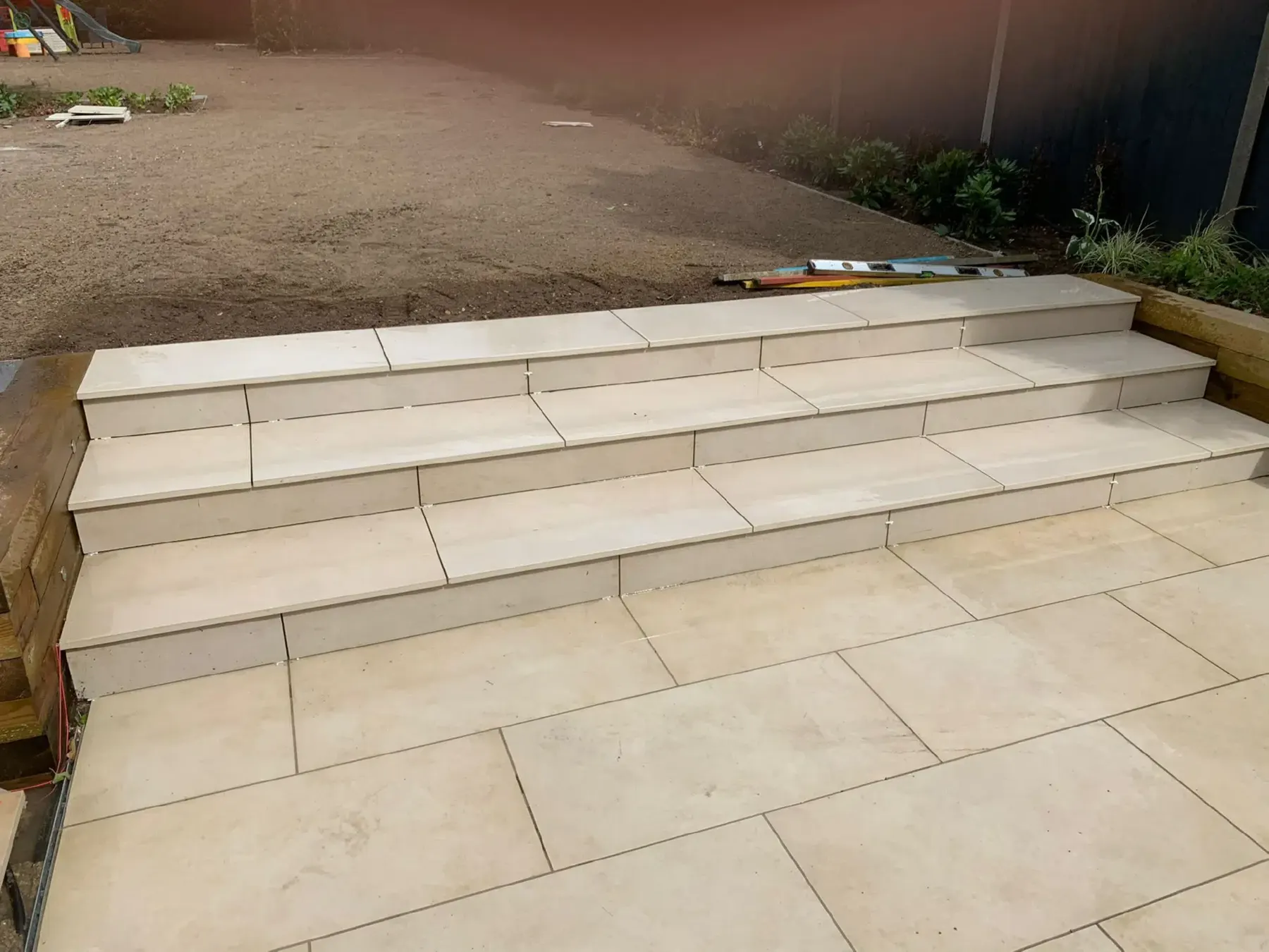 Porcelain steps and a patio in a London back garden